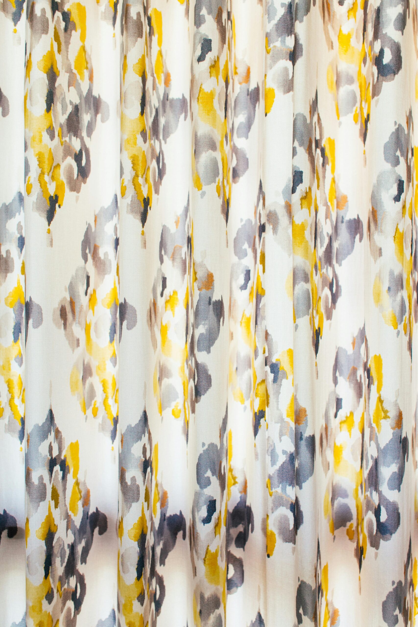 Vibrant abstract drapery with printed floral patterns, perfect for interior decor.